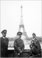 Adolf Hitler in front of the Eiffel Tower. 