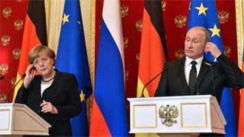 Queen Angela and "Putin" speaking through an interpreter, at a news conference in the Kremlin, 