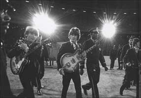 The Beatles walking to the stage 