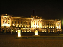 Buckingham Palace is lit up by 
