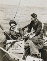 Molly Childers and Mary Spring Rice with rifles aboard Asgard. 