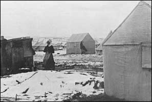 Women and children were forced to live in flimsy tents with snow on the ground. 