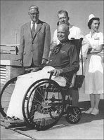 President Eisenhower in a wheel chair after his 1955 "heart attack."