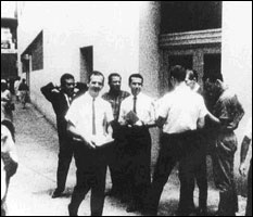 "Lee Harvey Oswald" handing out "Fair Play for Cuba" leaflets in New Orleans, August 16, 1963 