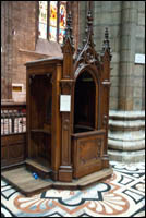 A replica of the first confessional box in Milan cathedral. 