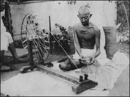 Emaciated Gandhi spinning a yarn. 