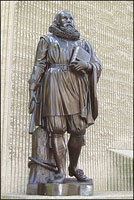 John Winthrop's statue in Boston. Winthrop is holding his Bible and Charter. 