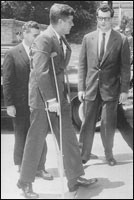 President Kennedy on crutches. 