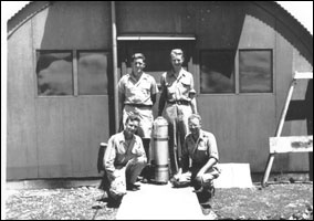 Alvarez (top right) on Tinian with Harold Agnew (top left), Lawrence H. Johnston (bottom left) and Bernard Waldman (bottom right).