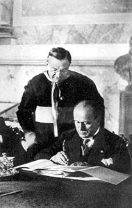 Mussolini signs Lateran  Treaty.