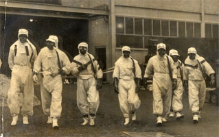 Nuclear firefighters in protective clothing ready