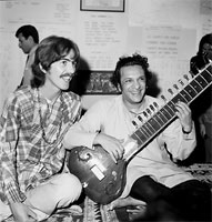 The fake "George" learning to play the sitar with Ravi Shankar. 