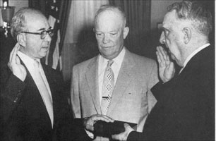 With his hand on the Bible, Lewis Strauss was sworn in as chairman of the AEC. 