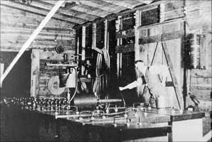 Tesla's assistant Kolman Czito prepares to throw the switch during the Pike's Peak experiment. 