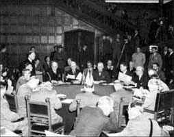 Session at Potsdam. President Truman is at the far side of the table with Secretary Byrnes and Admiral Leahy on the left. 